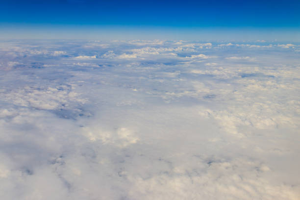 istock Beautiful white clouds in blue sky. View from airplane 1446717535