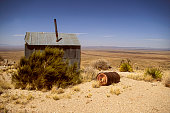 istock Deserted Cabin in the Desert 1446717604