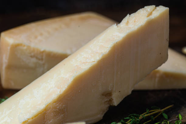 istock Parmesan cheese on a dark background close-up 1446717662