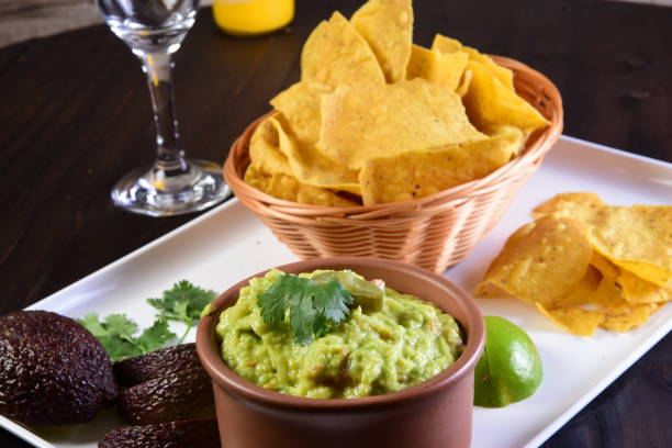 istock Guacamole Avocado Folder With Tomato Tomato Lemon Typical Mexican Tex Mex 1446717754