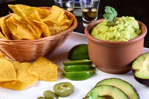 istock Guacamole Avocado Folder With Tomato Tomato Lemon Typical Mexican Tex Mex 1446717765