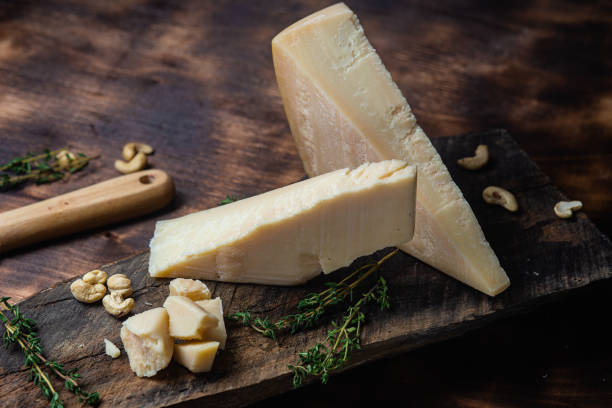 istock Parmesan cheese on a dark background close-up 1446717783