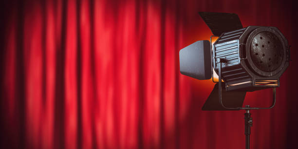 istock Stage or studio spotlight on red curtain background. Lighting equipment for Studio photography or videography. 1446717977