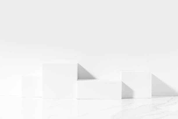 istock White template for product presentation made with white square podiums on white background in sunlight. Trendy fashion showcase mockup. 1446718767