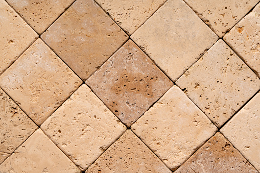 Travertine. Natural origin travertine tile background.