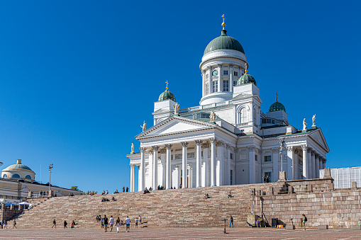 August, 2022. Helsinki, Finland. The main square of Helsinki in the old town on a sunny day with some tourists.