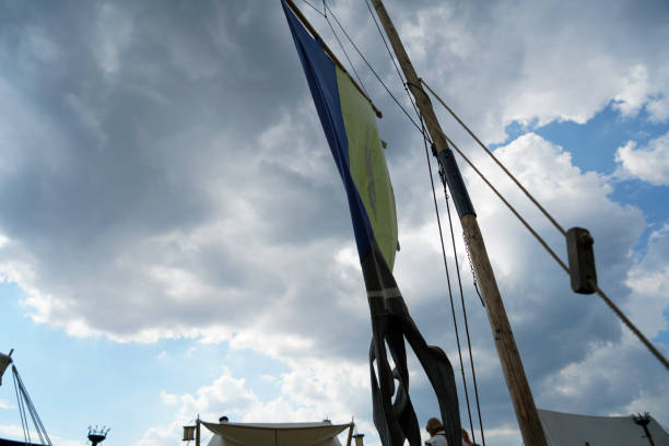 flag flies against a blue white sky on a summer day in Bavaria