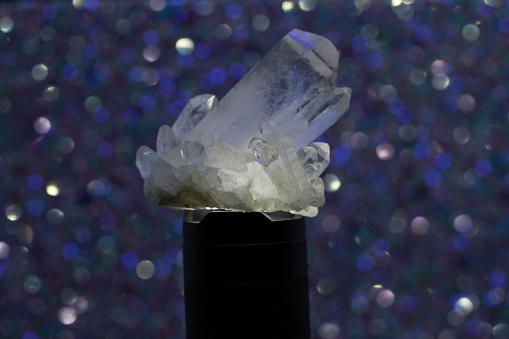 Quartz with mineral crystals photographed in the studio against a black background