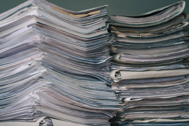 istock Stack of blank papers with binder clips on wooden table indoors. Workplace. Many documents, contracts, legal agreements, papers on work table. Concept of business, working, job 1446725906