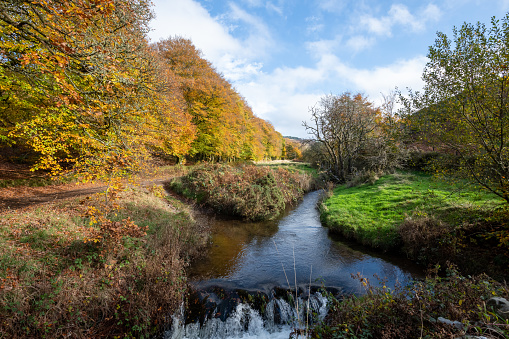 The Weir Water river flowing under Robbers Bridge in Exmoor National Park