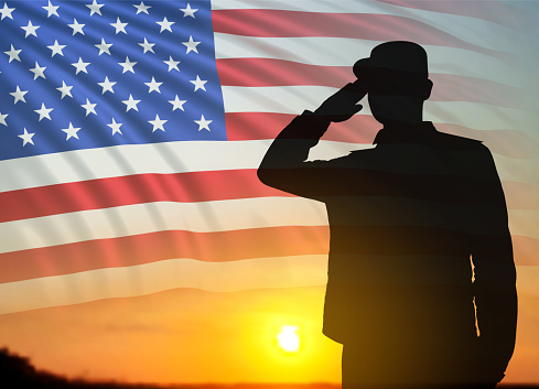 USA army soldier saluting on a background of sunset. USA flag. Veterans Day, Memorial Day, Independence Day background. National holidays concept. 3d-image