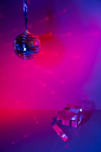 istock Glass prisms and a ball in colored light 1446729742