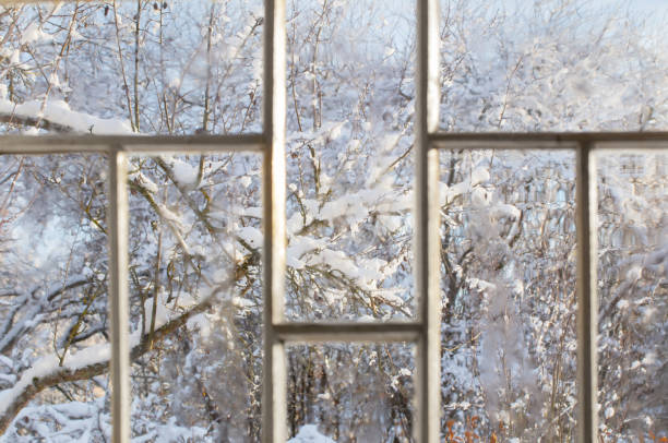istock old window with snowy beautiful landscape 1446729808