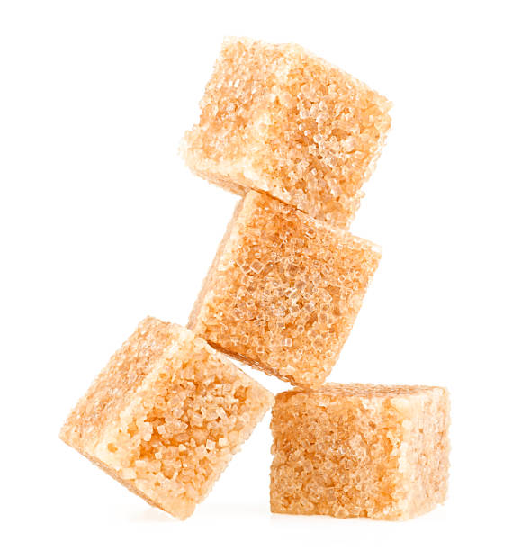 istock Brown cane sugar cubes isolated on a white background 1446729885