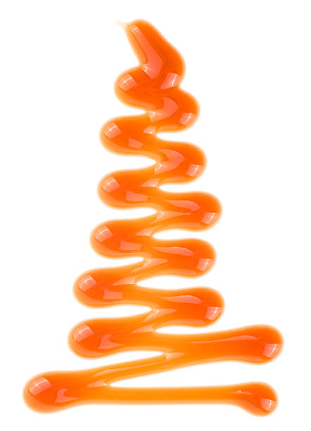 istock Liquid caramel sauce isolated on a white background, top view. Brown sugar syrup. 1446729892