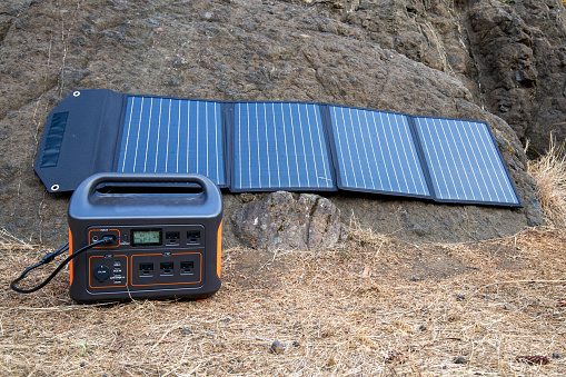 Portable Power Station Hooked up to Solar Panels to recharge