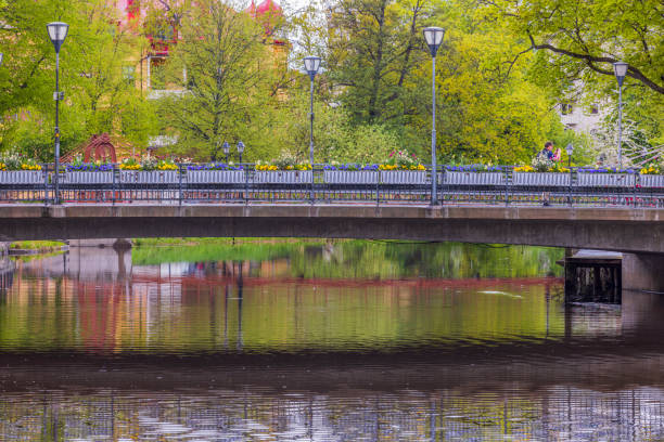 Stone Kungsportsbron bridge crossing Gothenburg canal with historic architecture in background Sweden