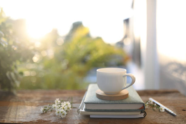 istock Tea cup and aster flowers on wooden table 1446731669