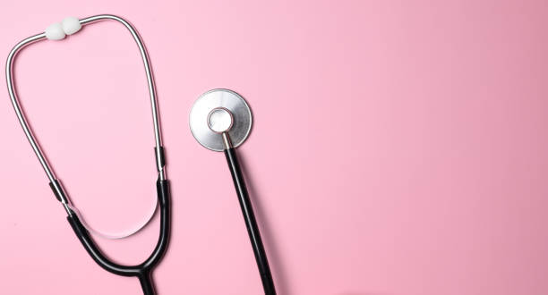 istock stethoscope on pink background top view, health background 1446731758