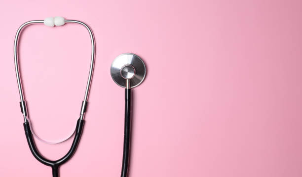 istock stethoscope on pink background top view, health background 1446731764
