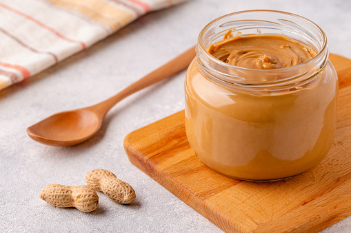 Peanut paste in an open jar