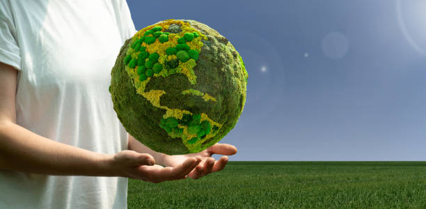 istock Woman holding a green planet Earth. 1446735796