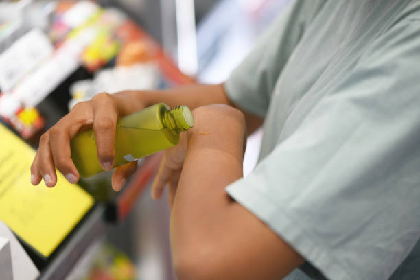 istock Woman testing a cosmetic product in a store 1446735888