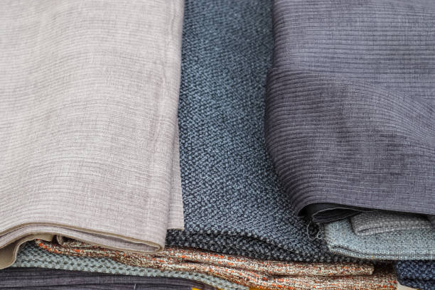 istock Samples of cloth and fabrics in different colors found at a fabrics market 1446737899