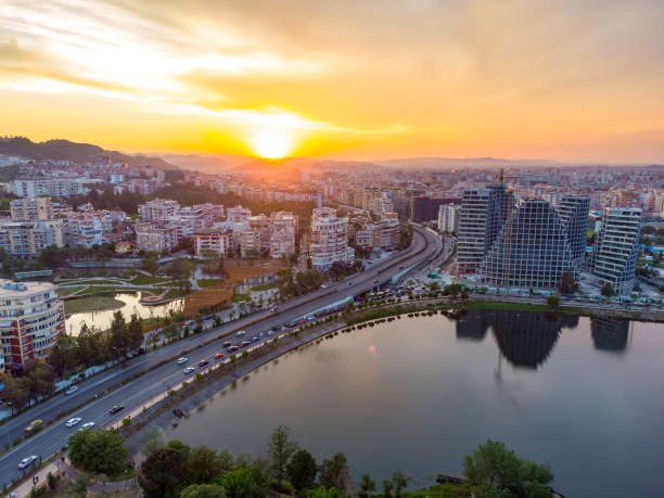 Aerial view of Tirana artificial lake, Albanian Capital at sunset Tirana from drone, dramatic sky artificial lake, Albanian Capital at sunset albania stock pictures, royalty-free photos & images