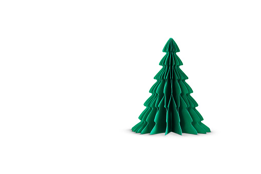 One paper Christmas tree isolated on white background. Copy space. Christmas craft, art and decoration concept.