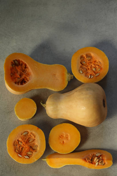 istock Cut sliced pumpkin on the grey background 1446742584