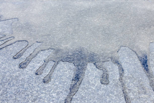 Spilled water on concrete floor, abstract background with copy space, full frame horizontal composition