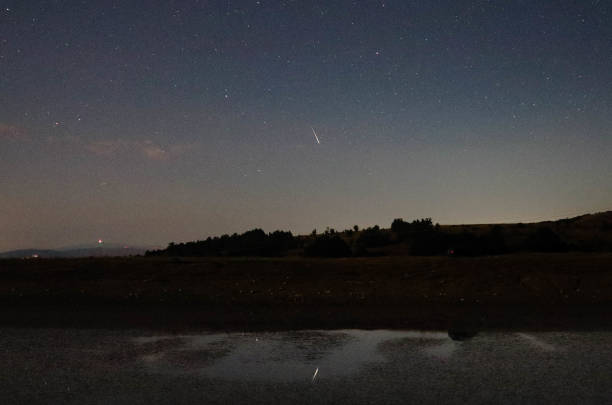 istock Shooting star above a lake 1446748268