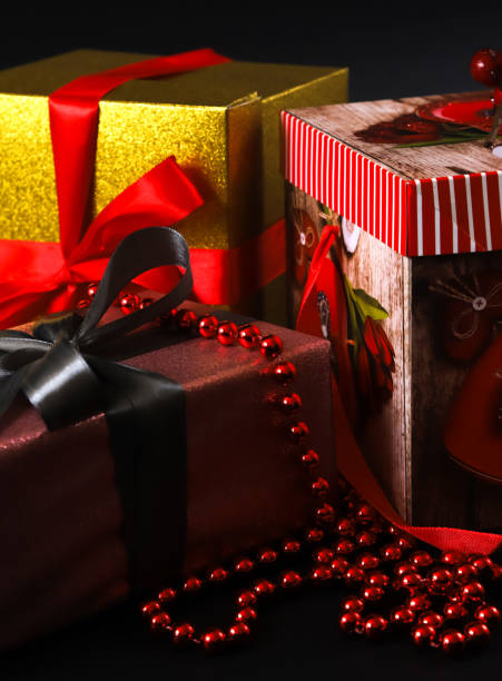 istock Christmas gift boxes of different colors on a dark background 1446749849