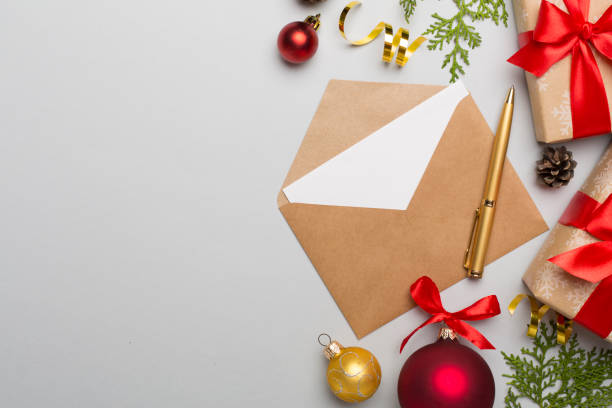 istock Craft envelope with christmas decoration on color background, top view 1446751257