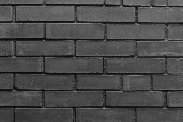 istock Black and white brick wall textured abstract background. 1446751262