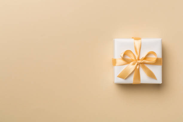istock White gift box on color background, top view 1446753256