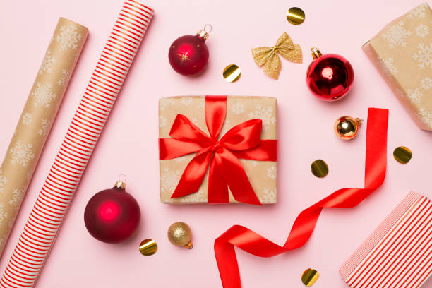 istock Gift boxes, paper's rools and decorations on color background, top view 1446753276