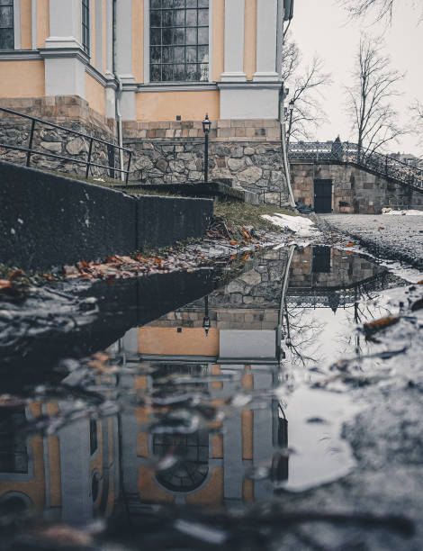 istock View of puddle next to a church during winter 1446756242