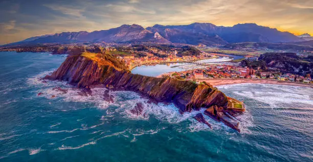 Aerial view of Ribadesella and its estuary at sunset in Asturias, Spain.