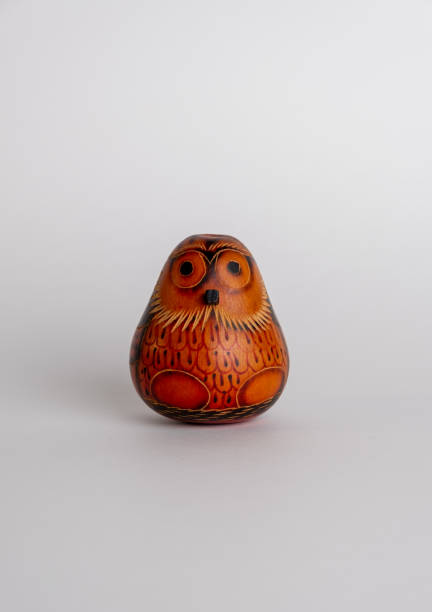 istock Owl (Strigiformes) carved from gourd, handcrafted isolated on white background 1446757649