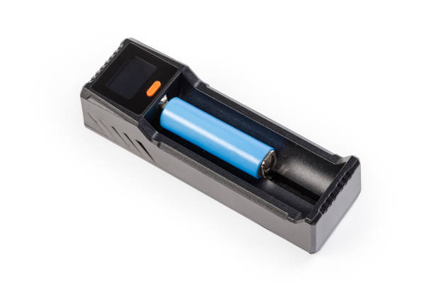 istock Battery charger for rechargeable batteries different types with inserted battery 1446758911