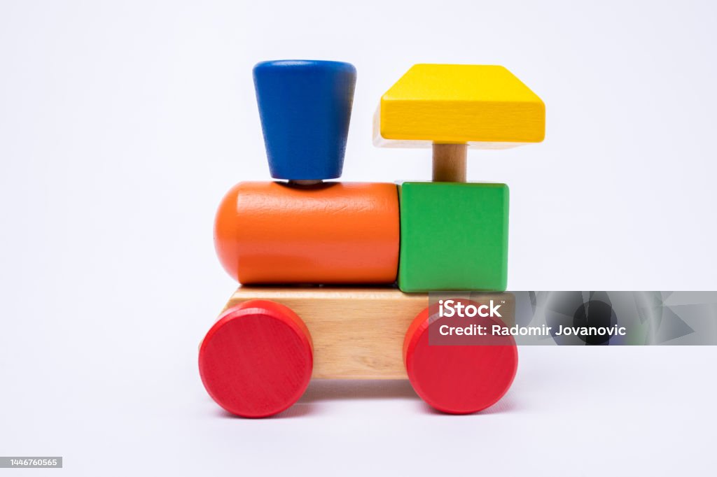 Wooden train toy isolated on white background Front view of a wooden colorful train toy isolated on white background. Attached Stock Photo