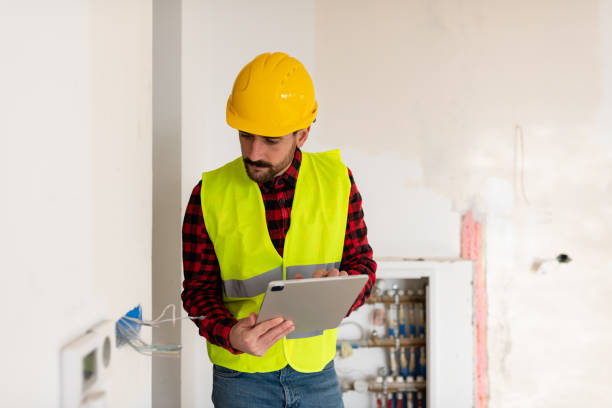 istock Electricity engineer checking the wiring in a new building 1446763016