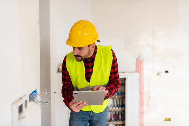 istock Electrician working on wiring on a construction site 1446764058