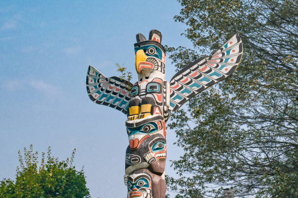 Totem poles are monuments created by First Nations of the Pacific Northwest to represent and commemorate ancestry, histories, or events.Creaded out of red cedar and erected to be visible within the community.They document stories and histories of clan members using stylised humans animals, and family crests.