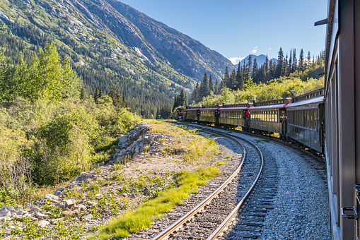 Skagway, AK - September 7, 2022: The White Pass and Yukon Route train winds it's way through the mountains east of Skagway.