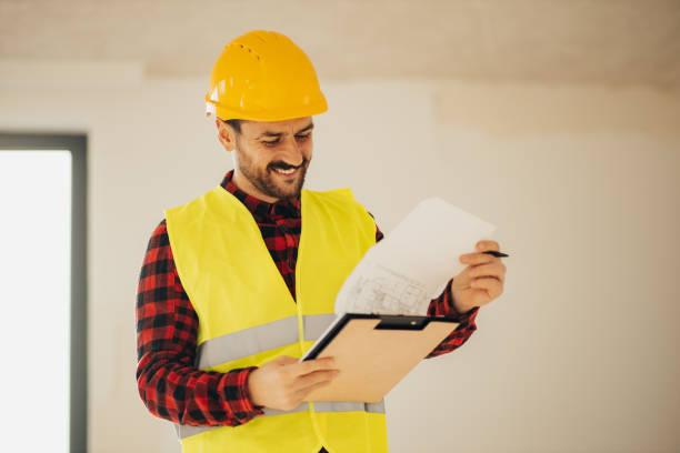 istock Handsome young inspector happy with a construction site 1446771158