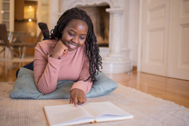 istock Woman relaxing and reading a book 1446773717