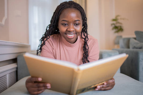 istock Woman relaxing and reading a book 1446773718